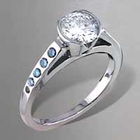 white center diamond, green accent diamonds engagement ring